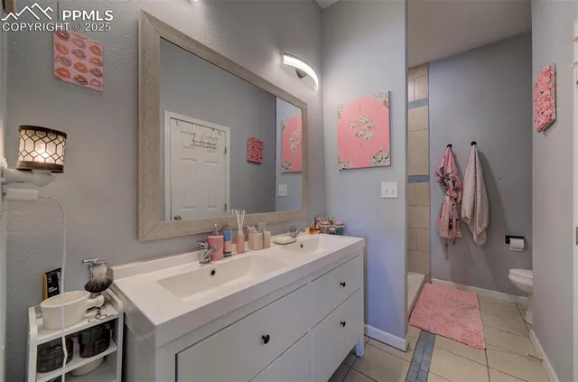 a bathroom with a sink vanity and a mirror