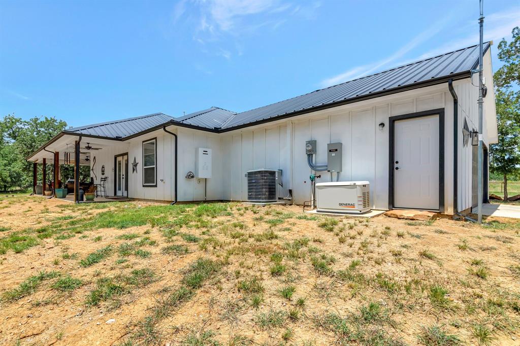 129 Whiskey Rnch Road Runaway Bay, TX 76426 - Photo 29 of 39 a house view with a outdoor space