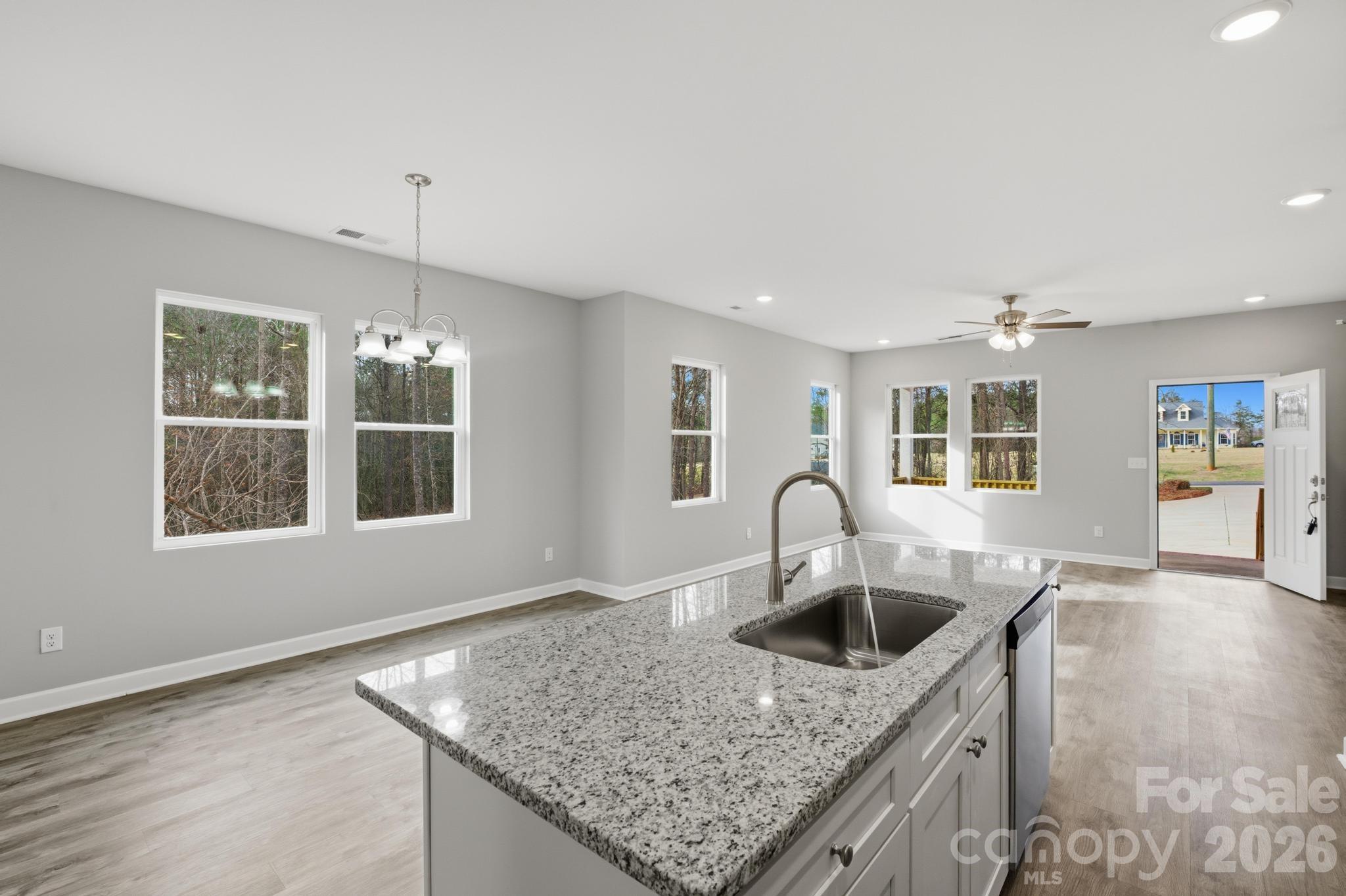 368 Lippard Farm Road Statesville, NC 28625 - Photo 11 of 29 a kitchen with granite countertop a sink a counter and kitchen countertops