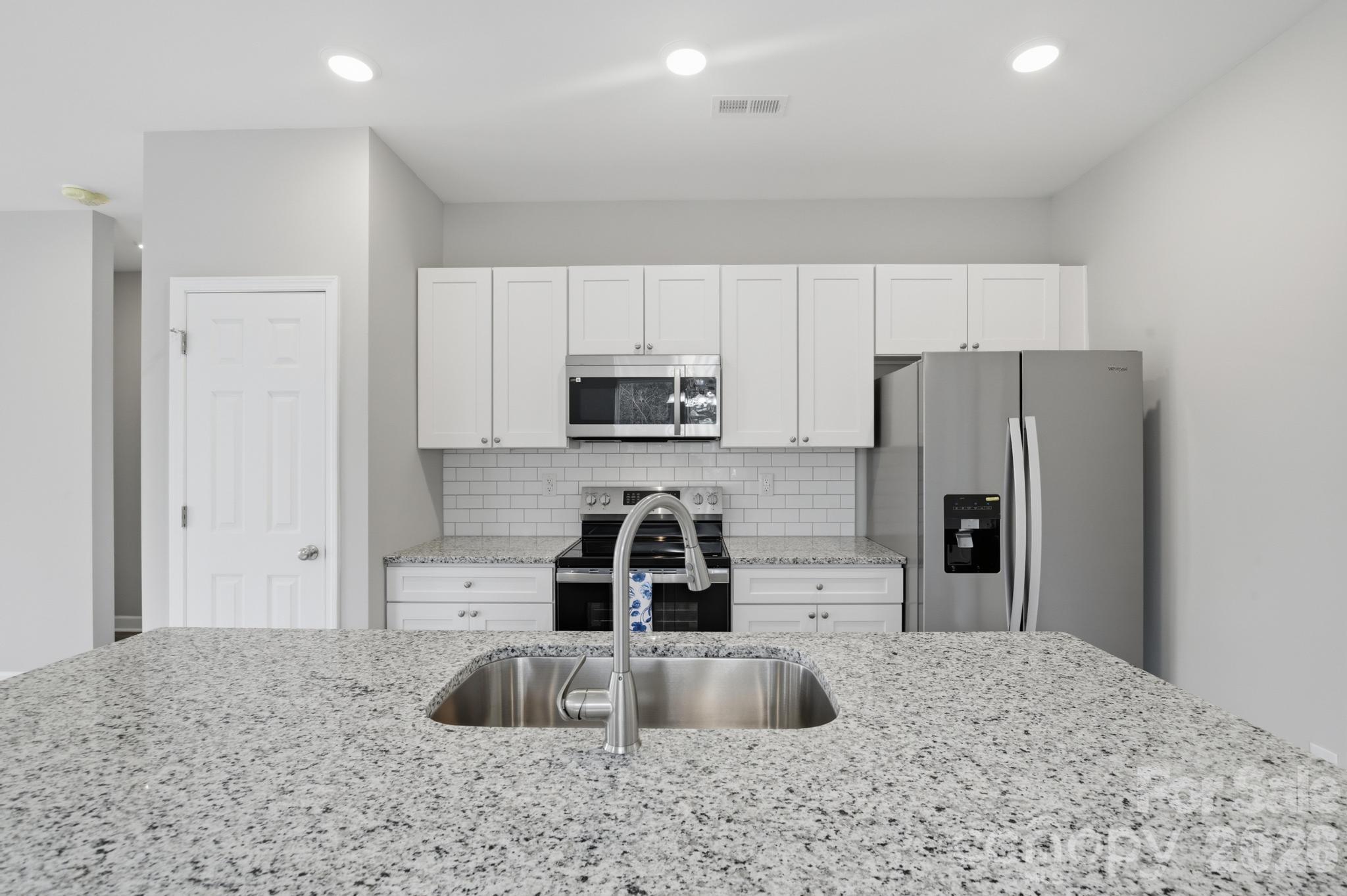 368 Lippard Farm Road Statesville, NC 28625 - Photo 14 of 29 a kitchen with stainless steel appliances a refrigerator and a sink