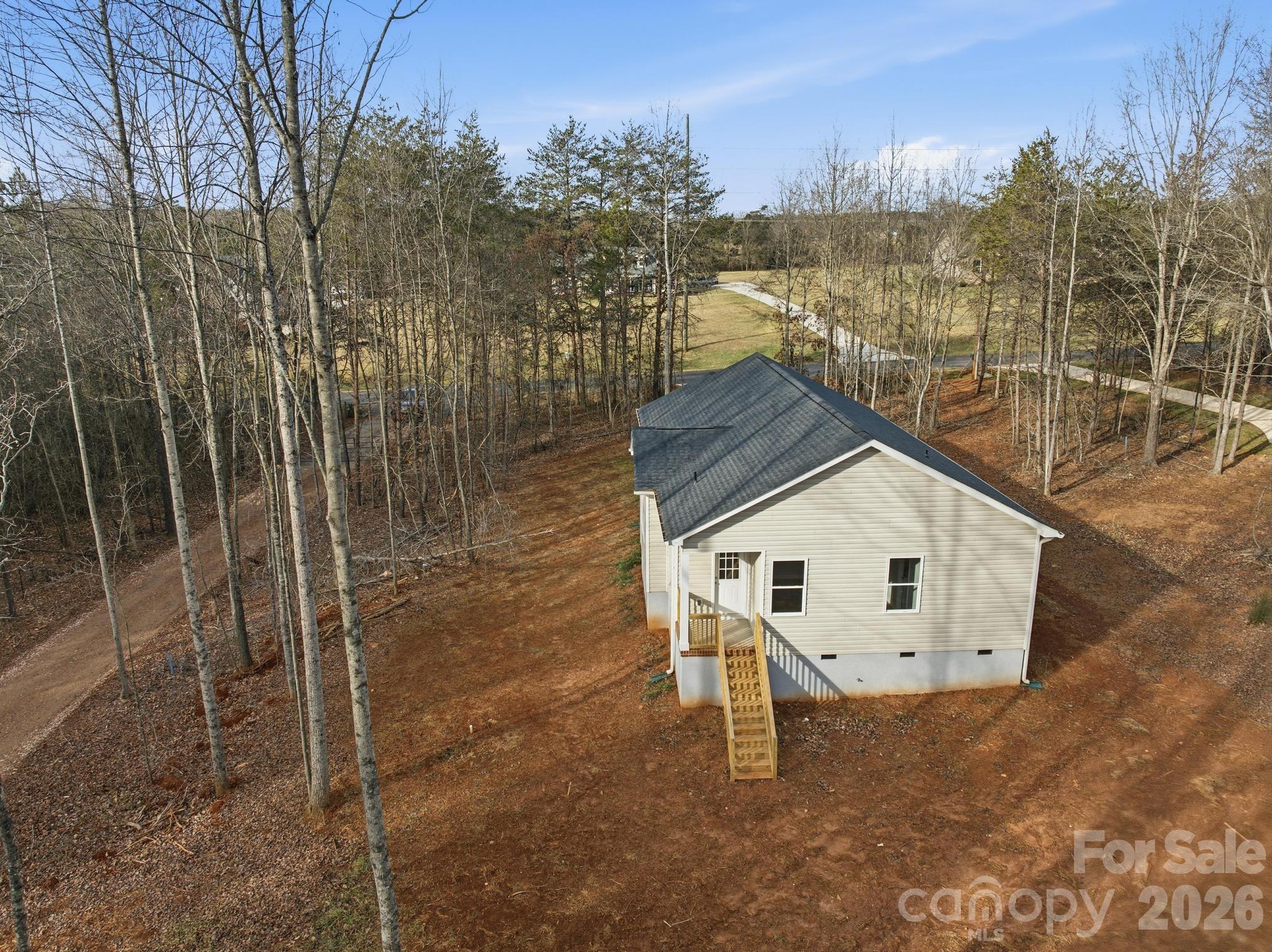 368 Lippard Farm Road Statesville, NC 28625 - Photo 26 of 29 a view of a house with a yard
