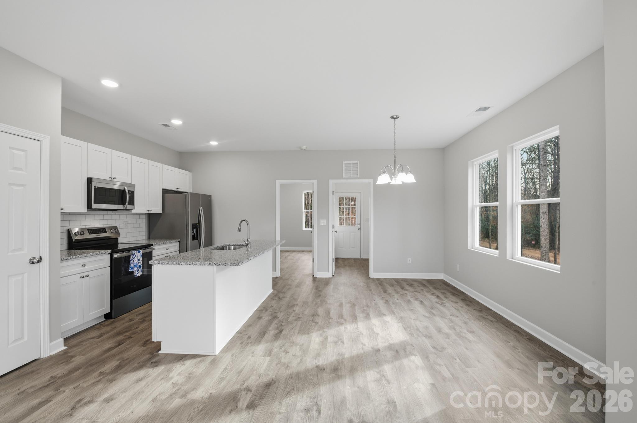 368 Lippard Farm Road Statesville, NC 28625 - Photo 8 of 29 a view of a kitchen with microwave and cabinets