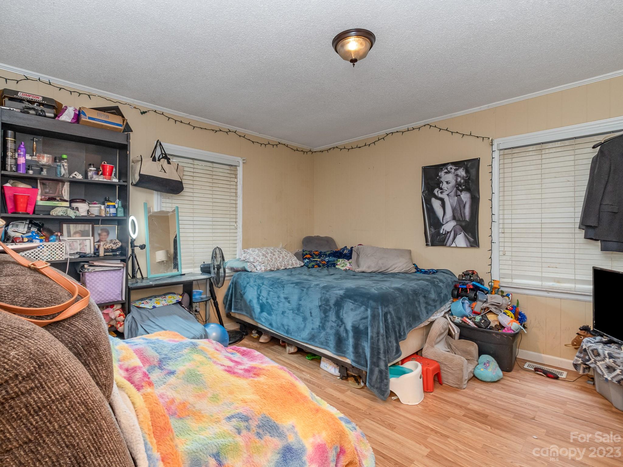 648 Blacksnake Road Stanley, NC 28164 - Photo 19 of 24 a bedroom with a bed and a desk