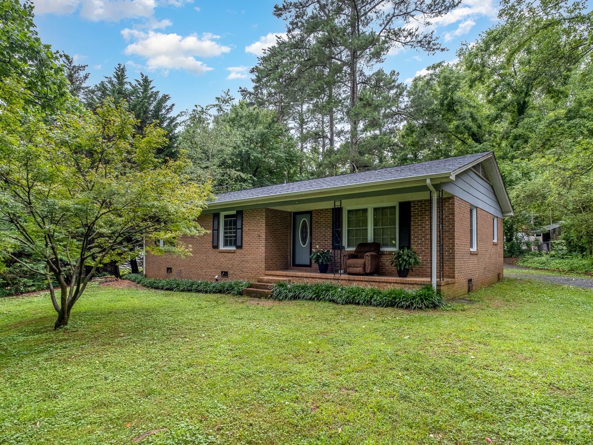 648 Blacksnake Road Stanley, NC 28164 - Photo 2 of 24 a view of a house with a yard