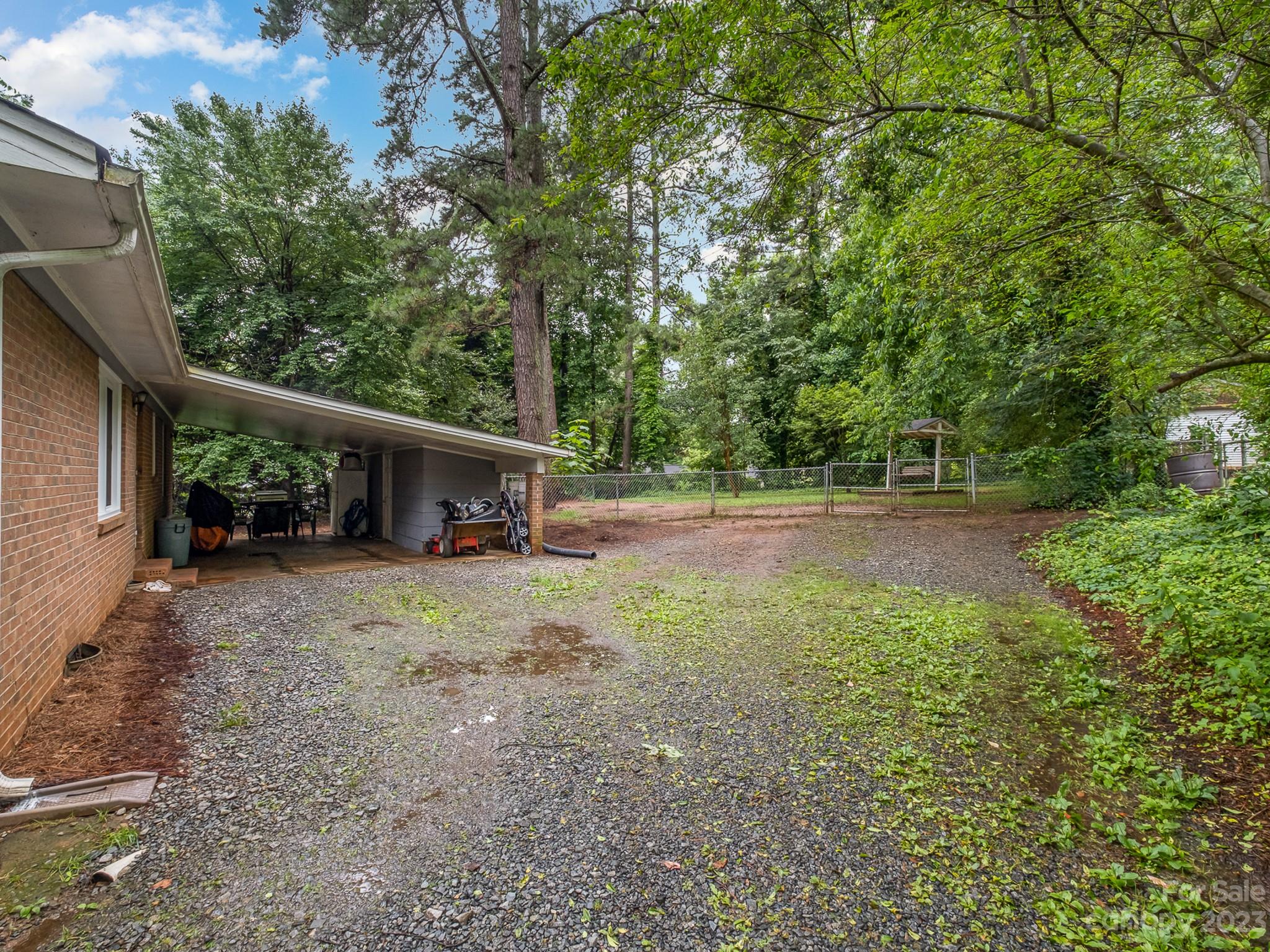 648 Blacksnake Road Stanley, NC 28164 - Photo 23 of 24 a view of backyard with large trees
