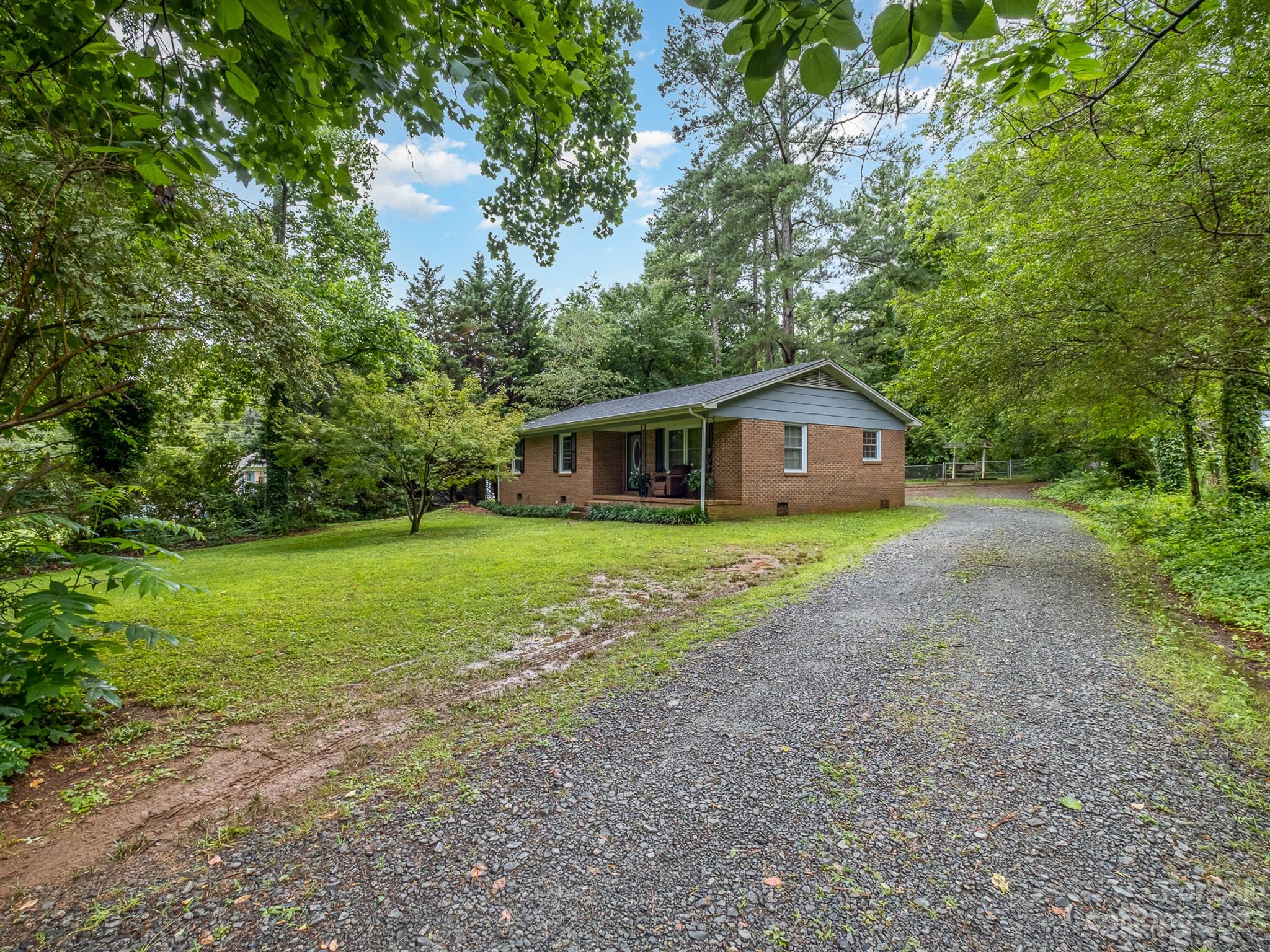 648 Blacksnake Road Stanley, NC 28164 - Photo 3 of 24 a house view with a garden space