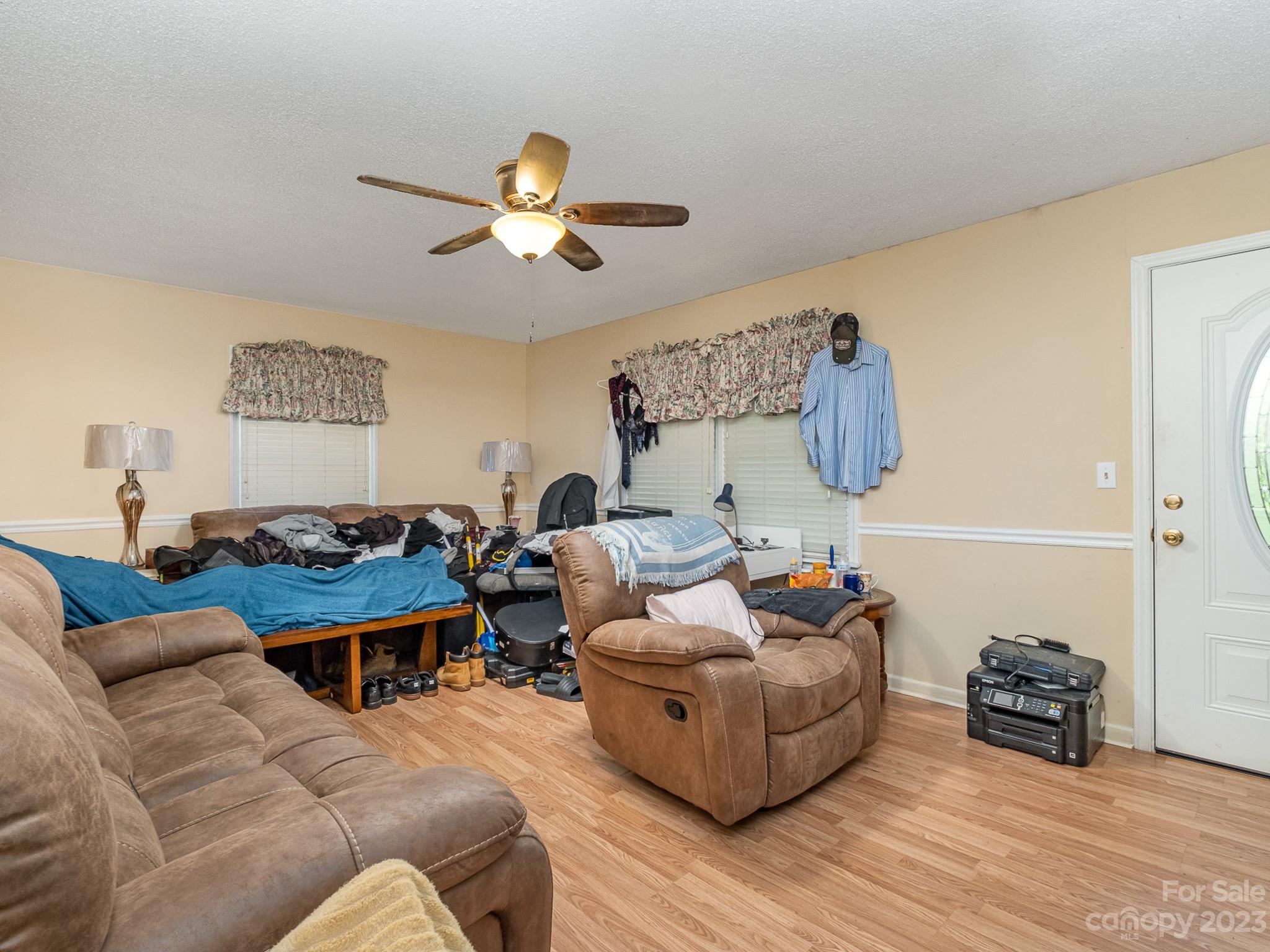 648 Blacksnake Road Stanley, NC 28164 - Photo 6 of 24 a living room with furniture and a wooden floor