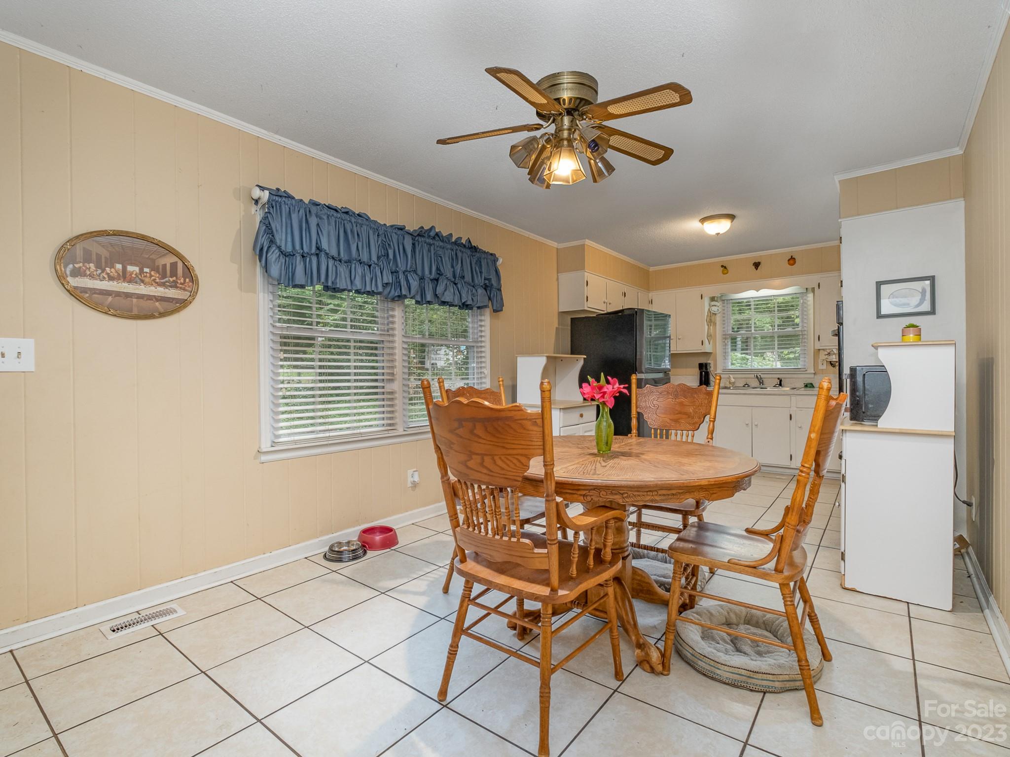 648 Blacksnake Road Stanley, NC 28164 - Photo 9 of 24 a view of a dining room with furniture and chandelier