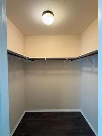 a bathroom with a double vanity sink toilet and shower