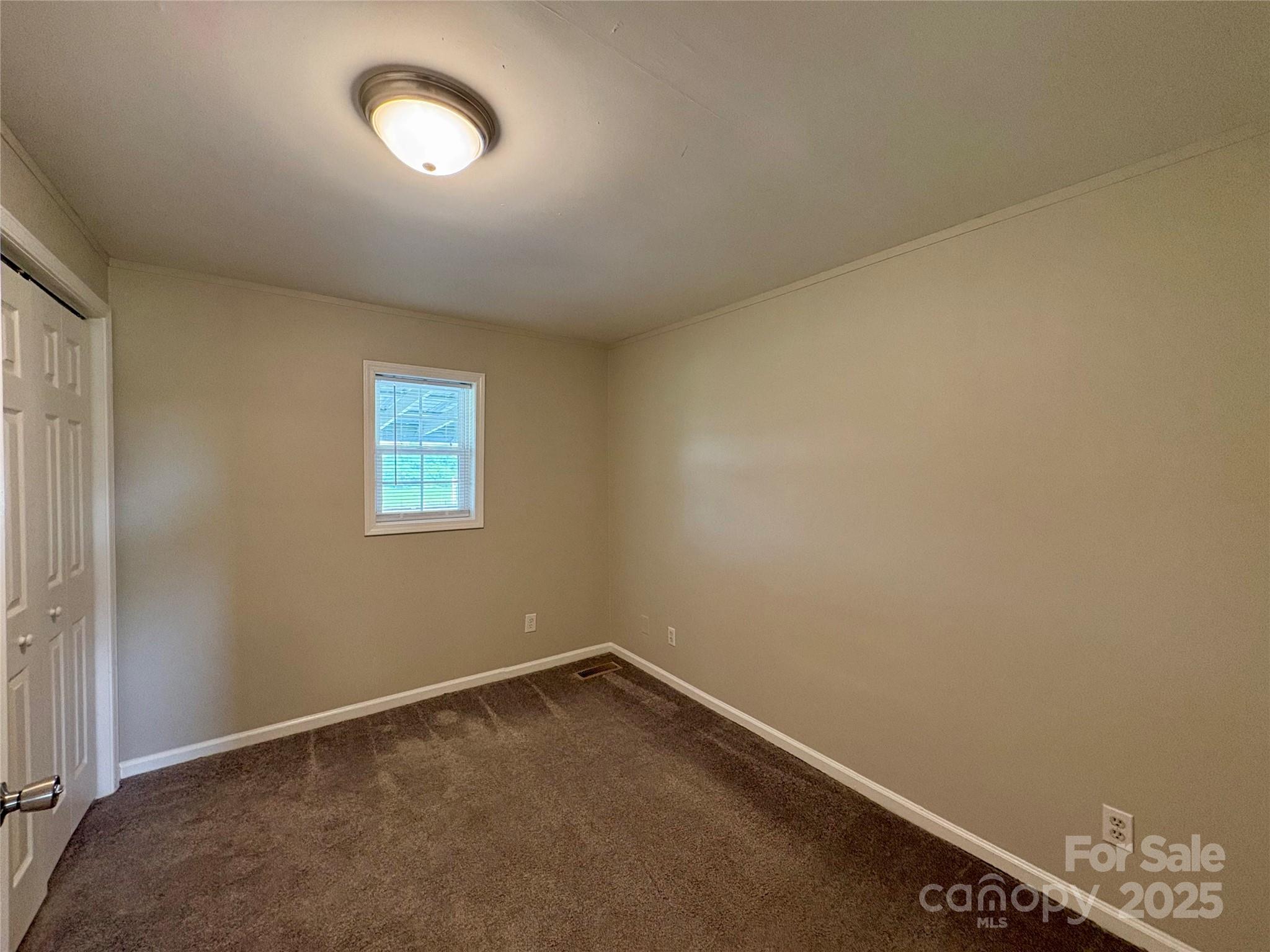 3123 Stack Road Monroe, NC 28112 - Photo 22 of 28 an empty room with a window
