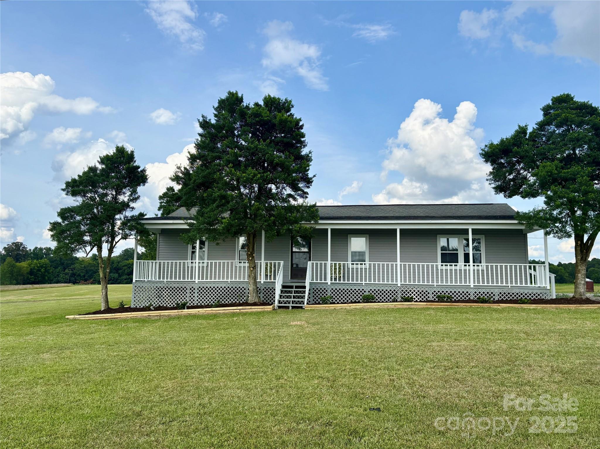 3123 Stack Road Monroe, NC 28112 - Photo 3 of 28 a front view of a house with a garden