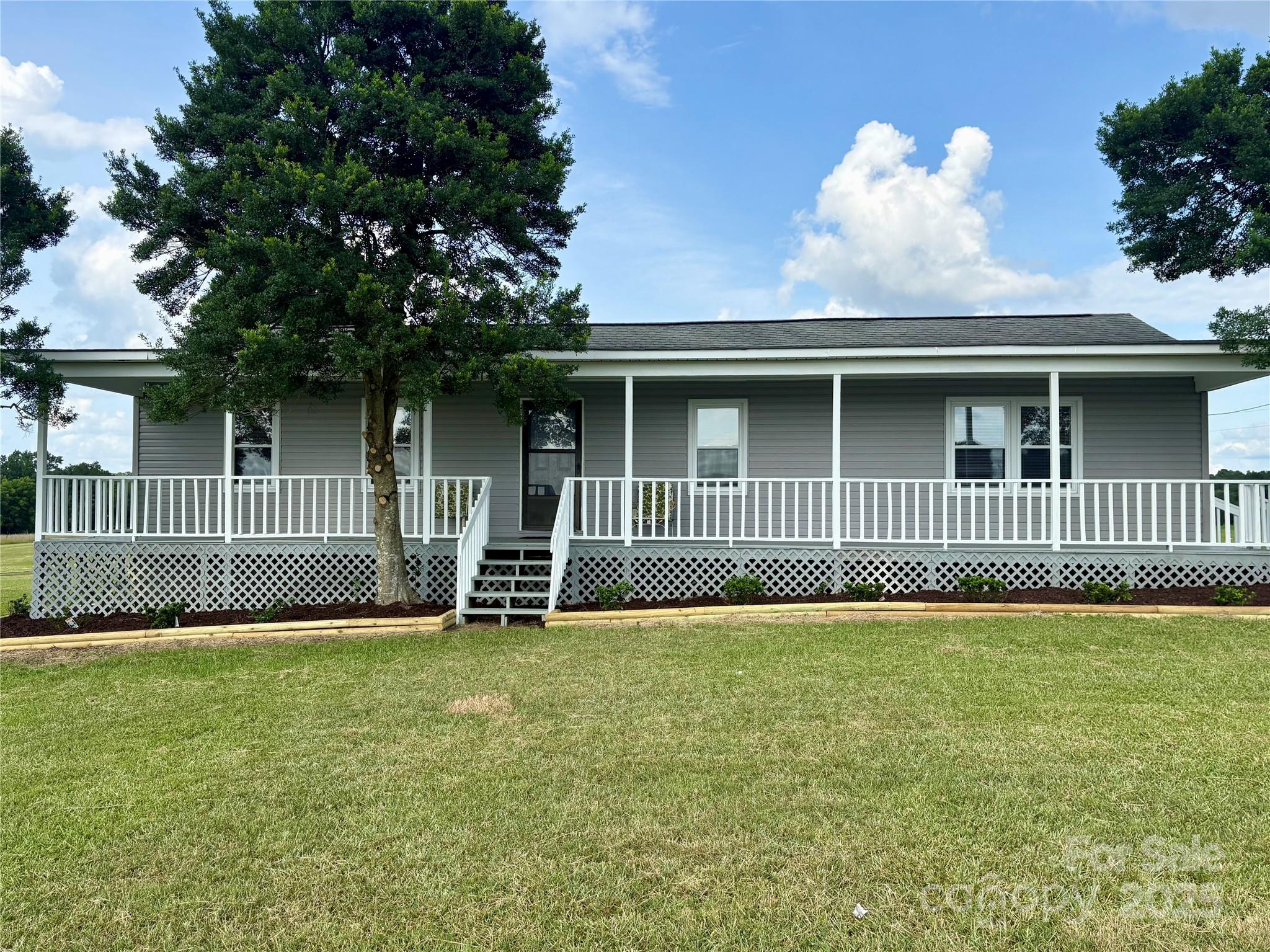 3123 Stack Road Monroe, NC 28112 - Photo 4 of 28 a view of a house with a yard and a garden