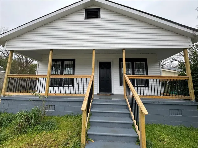 a view of a house with iron stairs