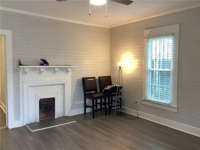 a view of a livingroom with furniture and a fireplace