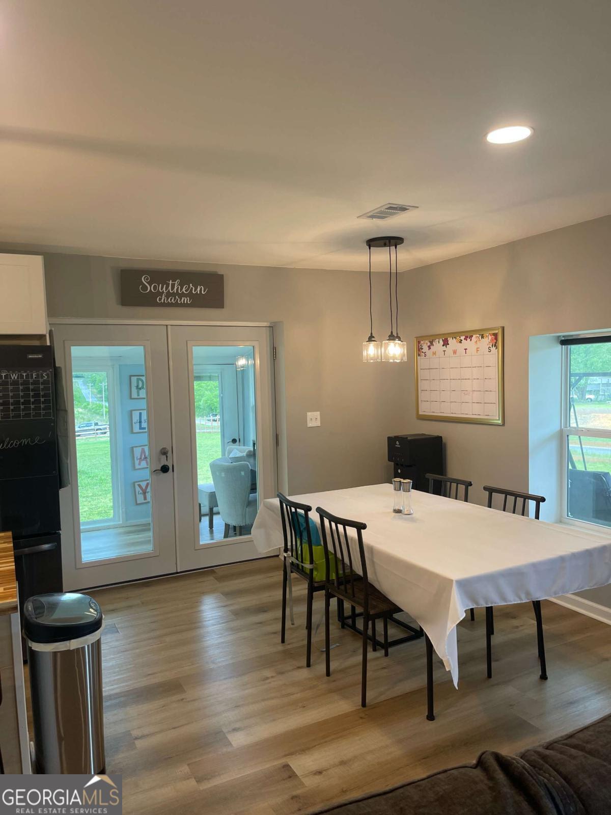 433 Spring Place Resaca Road Chatsworth, GA 30705 - Photo 11 of 60 a view of a dining room with furniture window and wooden floor