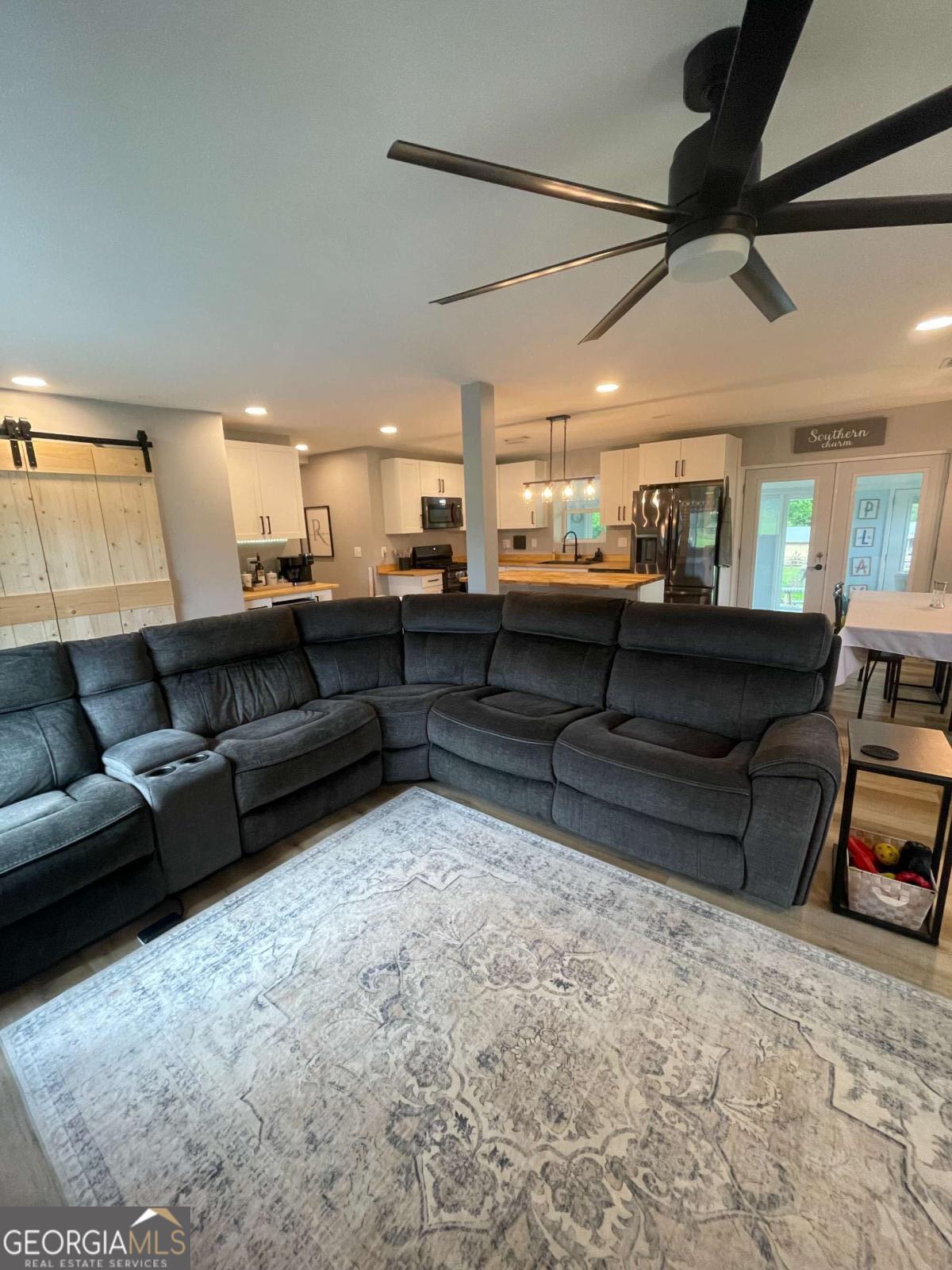 433 Spring Place Resaca Road Chatsworth, GA 30705 - Photo 25 of 60 a living room with furniture and a flat screen tv