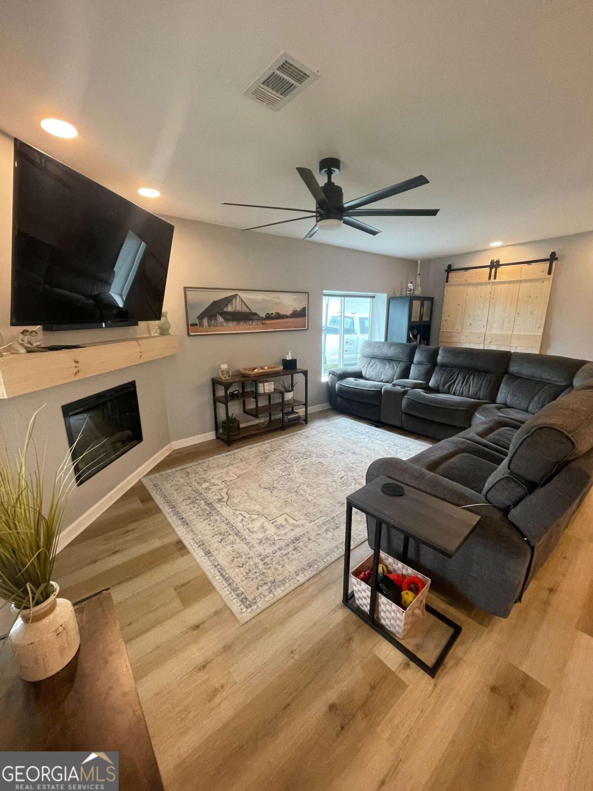 433 Spring Place Resaca Road Chatsworth, GA 30705 - Photo 27 of 60 a living room with furniture and a flat screen tv