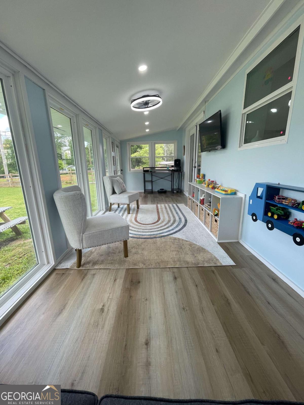 433 Spring Place Resaca Road Chatsworth, GA 30705 - Photo 33 of 60 a view of a livingroom with furniture window and wooden floor