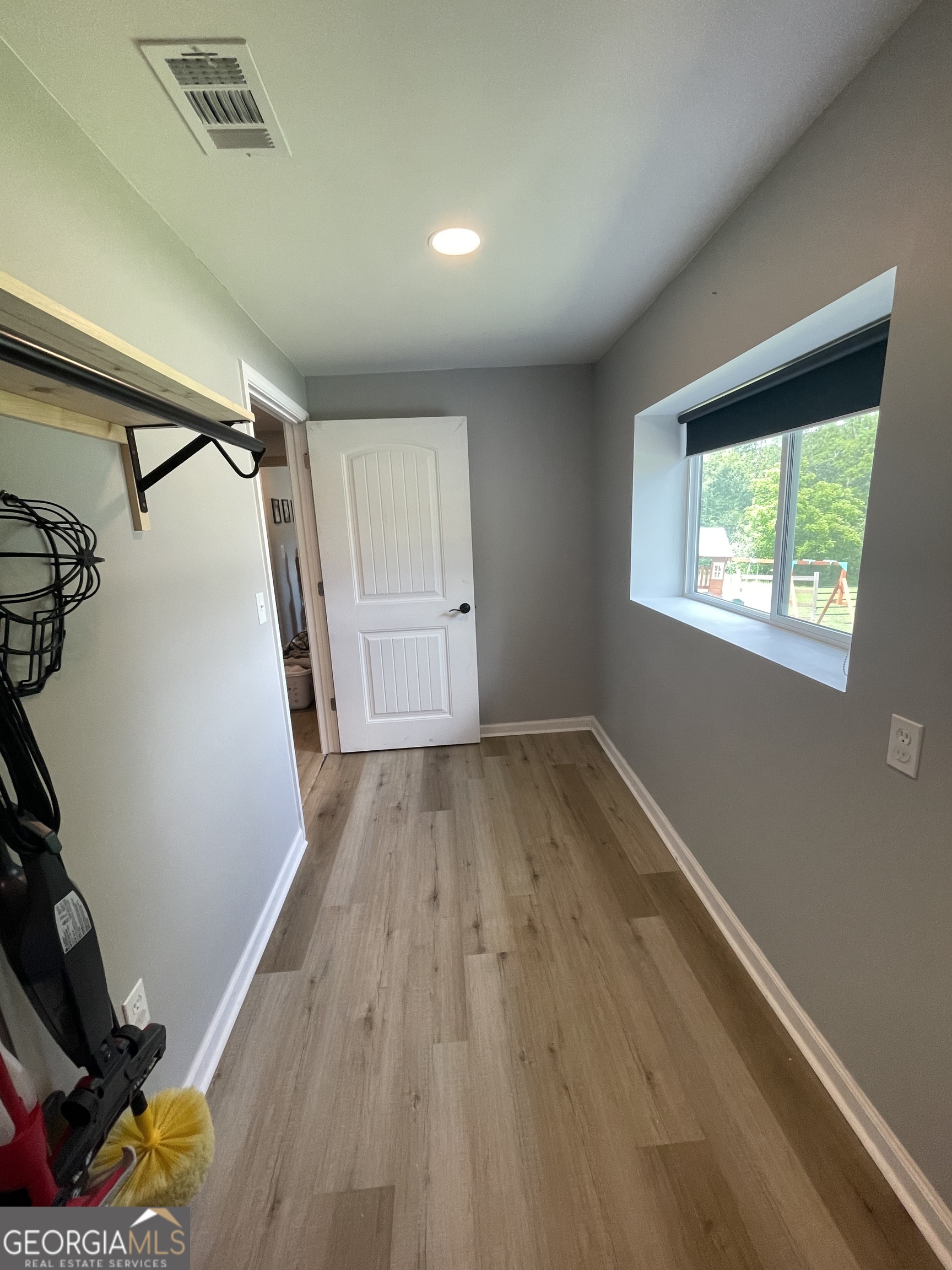 433 Spring Place Resaca Road Chatsworth, GA 30705 - Photo 50 of 60 a view of empty room with wooden floor and fan