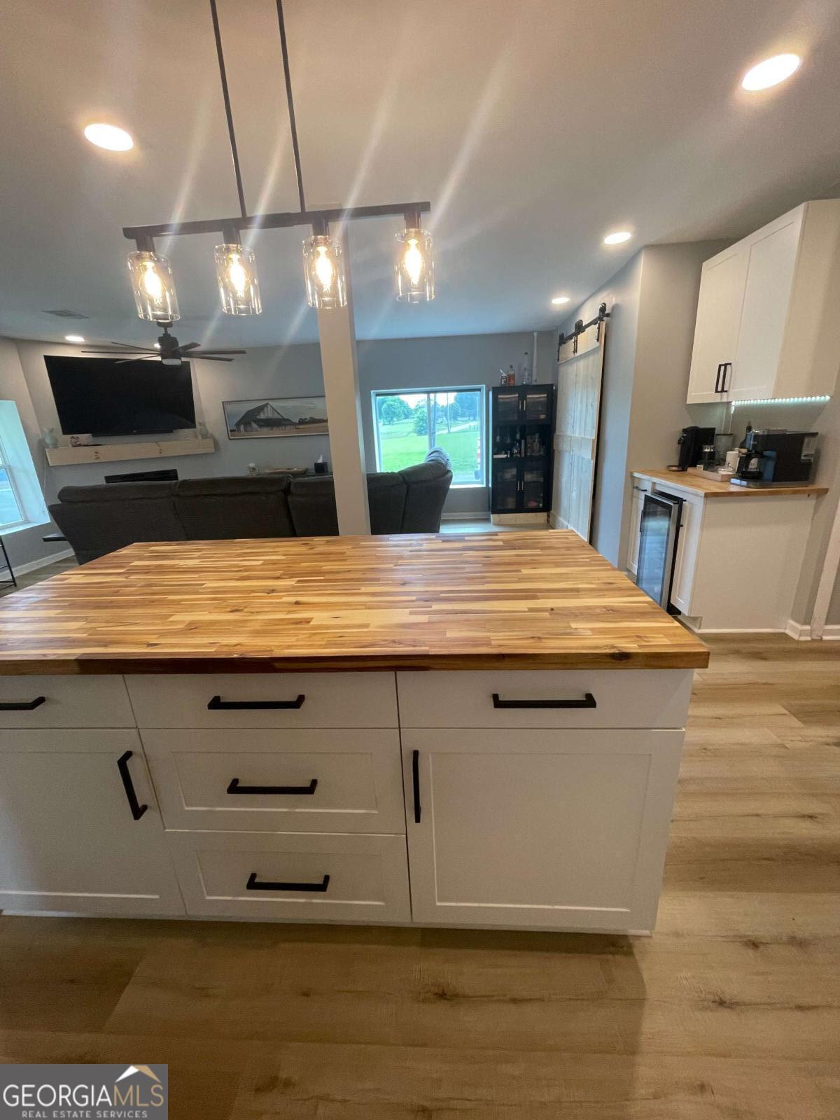 433 Spring Place Resaca Road Chatsworth, GA 30705 - Photo 5 of 60 a view of a kitchen with kitchen island a sink stainless steel appliances and cabinets