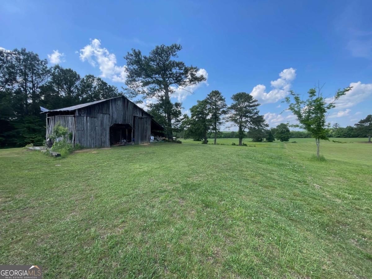 433 Spring Place Resaca Road Chatsworth, GA 30705 - Photo 54 of 60 a backyard of a house with lots of green space