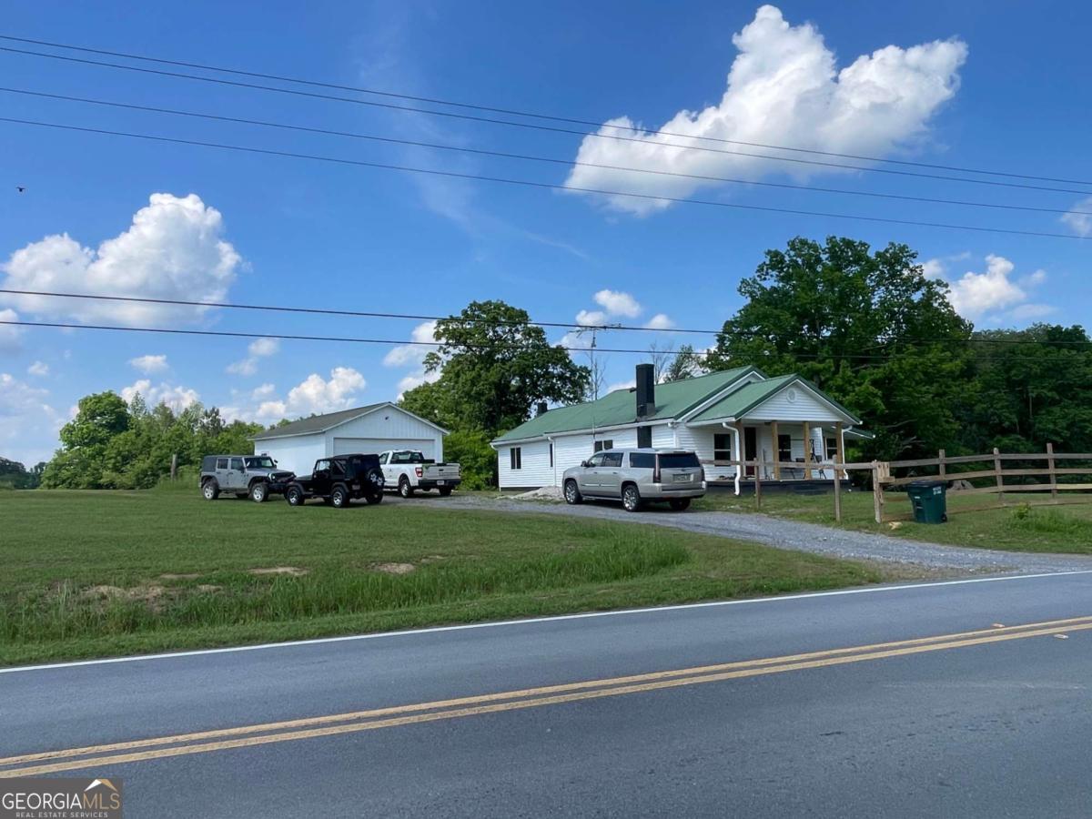 433 Spring Place Resaca Road Chatsworth, GA 30705 - Photo 7 of 60 a front view of a house with a yard