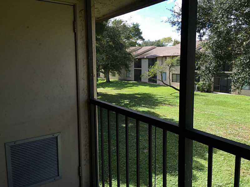 21955 Tidewater Terrace, Unit 208 Boca Raton, FL 33433 - Photo 16 of 26 a view of a porch with a yard