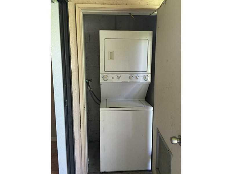 21955 Tidewater Terrace, Unit 208 Boca Raton, FL 33433 - Photo 17 of 26 a close up view of a utility room with washer and dryer