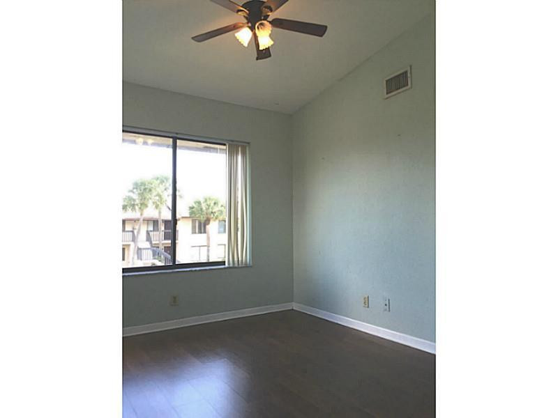 21955 Tidewater Terrace, Unit 208 Boca Raton, FL 33433 - Photo 18 of 26 a view of an empty room with a window