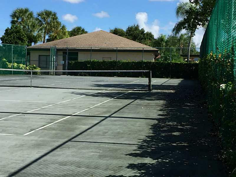 21955 Tidewater Terrace, Unit 208 Boca Raton, FL 33433 - Photo 22 of 26 a front view of a house with plants