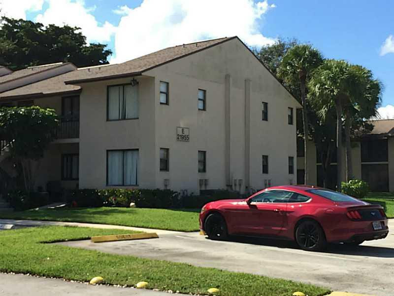 21955 Tidewater Terrace, Unit 208 Boca Raton, FL 33433 - Photo 24 of 26 a front view of a house with a garden