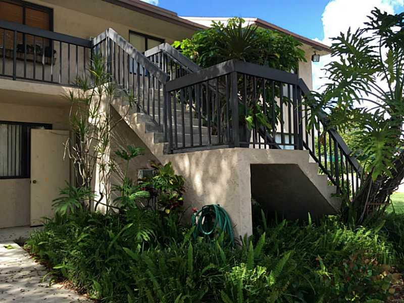 21955 Tidewater Terrace, Unit 208 Boca Raton, FL 33433 - Photo 3 of 26 a view of a house with a yard