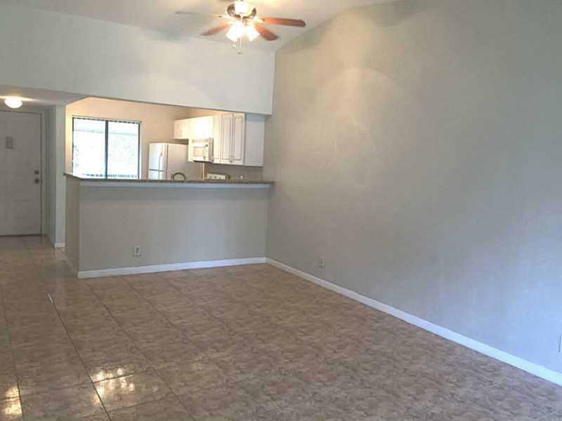 21955 Tidewater Terrace, Unit 208 Boca Raton, FL 33433 - Photo 8 of 26 wooden floor in an empty room with a window