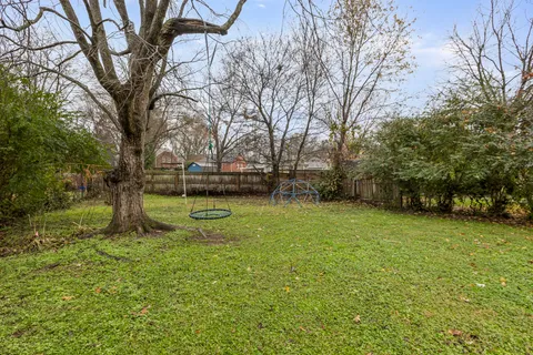 a view of a field with trees
