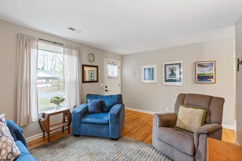 a living room with furniture and a window