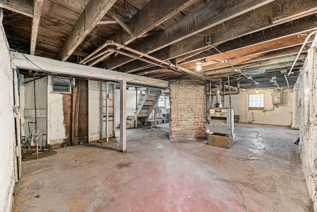a view of empty room with wooden walls