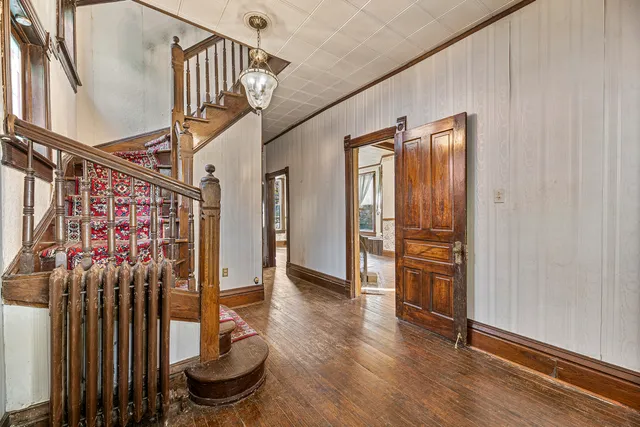 a view of entryway with wooden floor