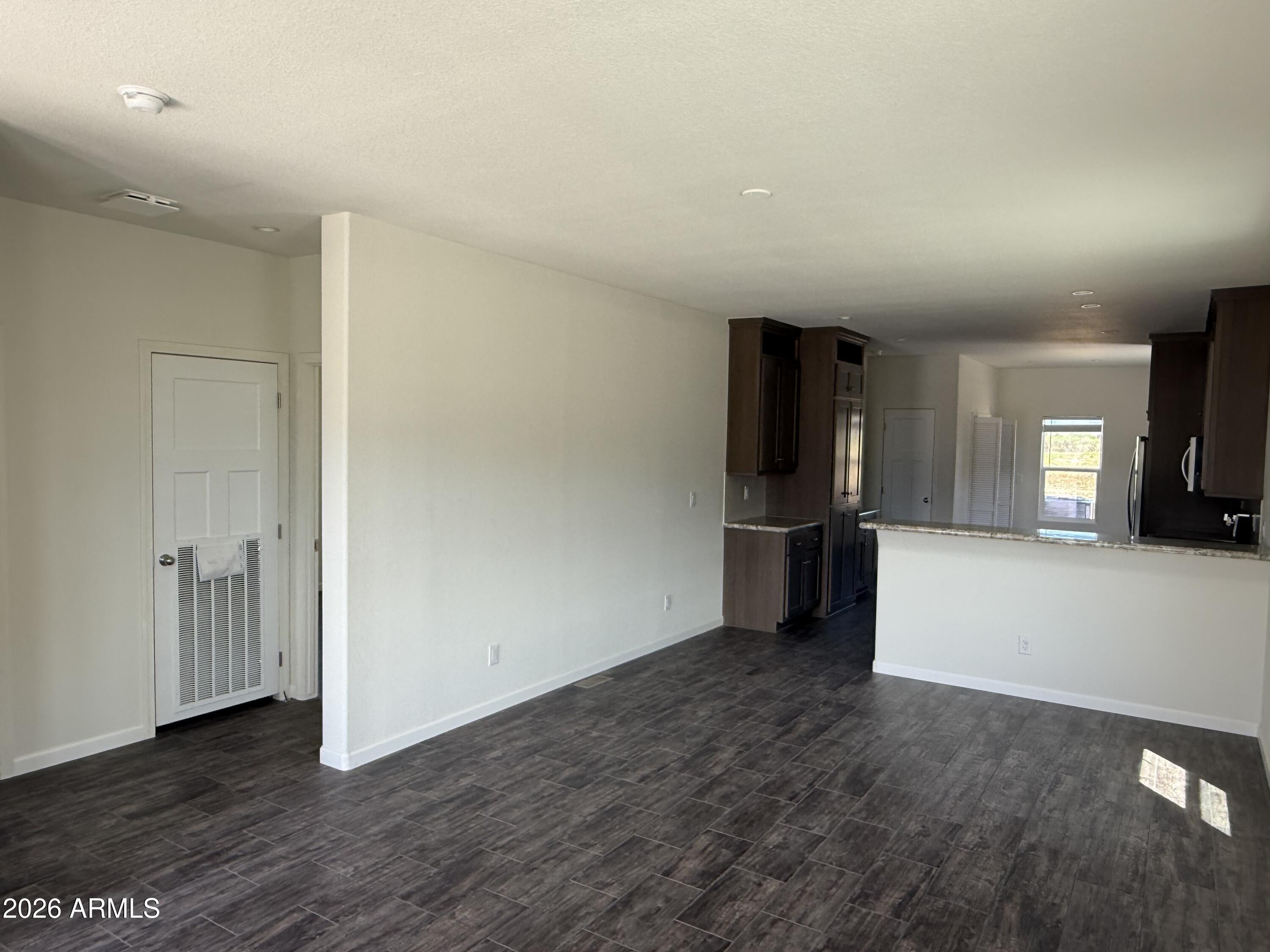20 Ranch Drive Camp Verde, AZ 86322 - Photo 11 of 31 an empty room with wooden floor and closet