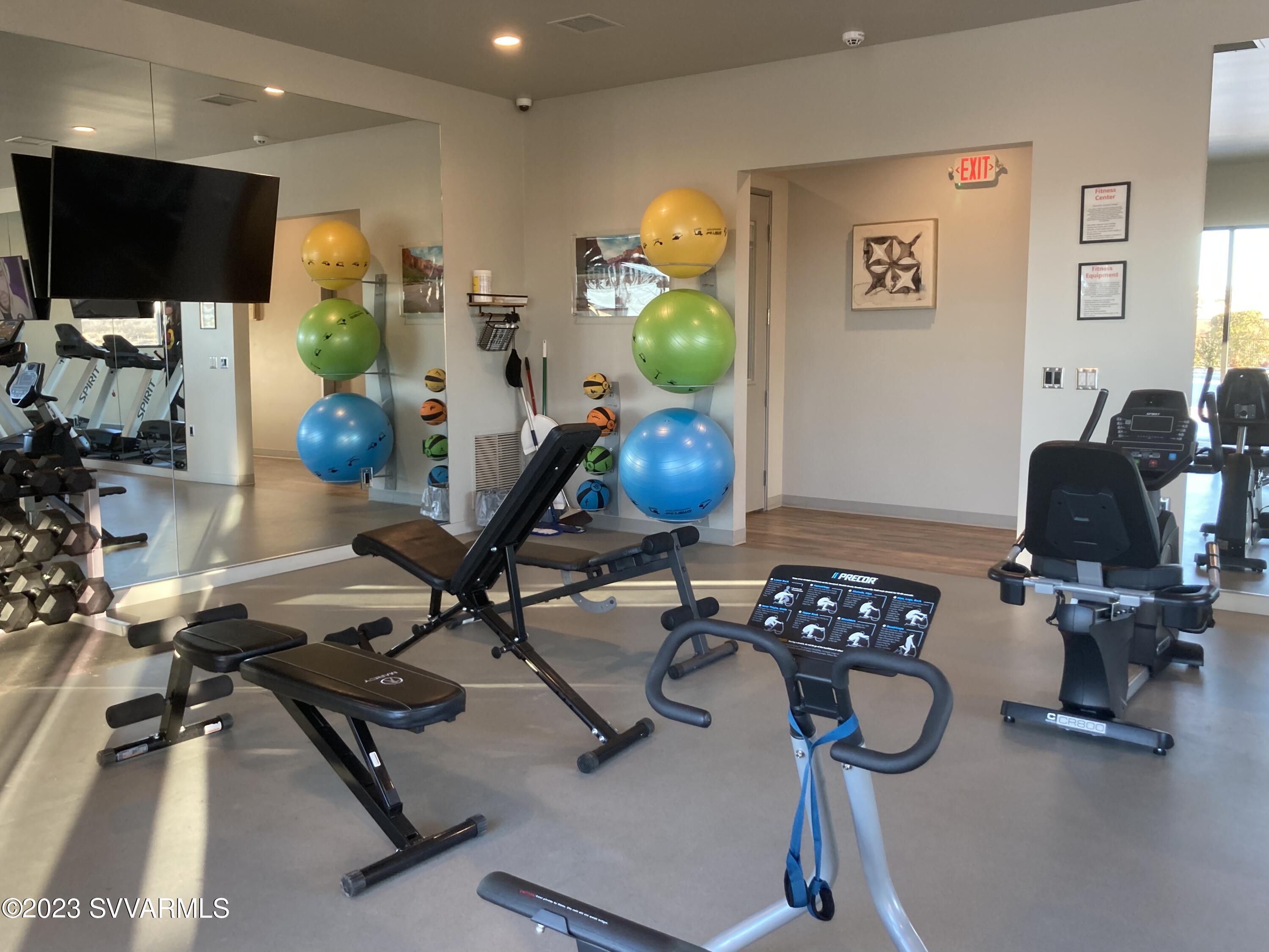 20 Ranch Drive Camp Verde, AZ 86322 - Photo 24 of 31 a room with gym equipment and a flat screen tv