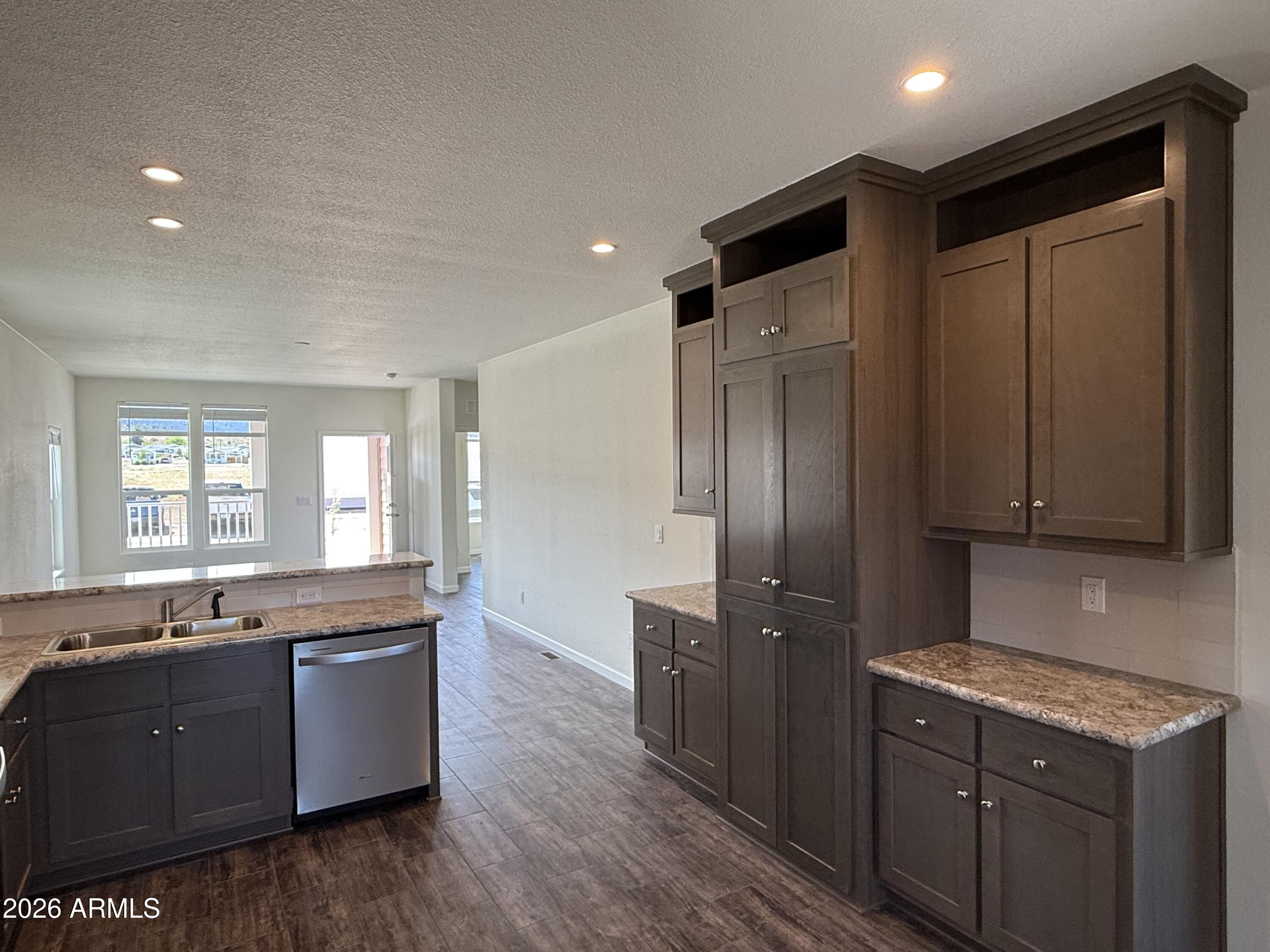 20 Ranch Drive Camp Verde, AZ 86322 - Photo 9 of 31 a large kitchen with stainless steel appliances granite countertop a sink a stove and a refrigerator