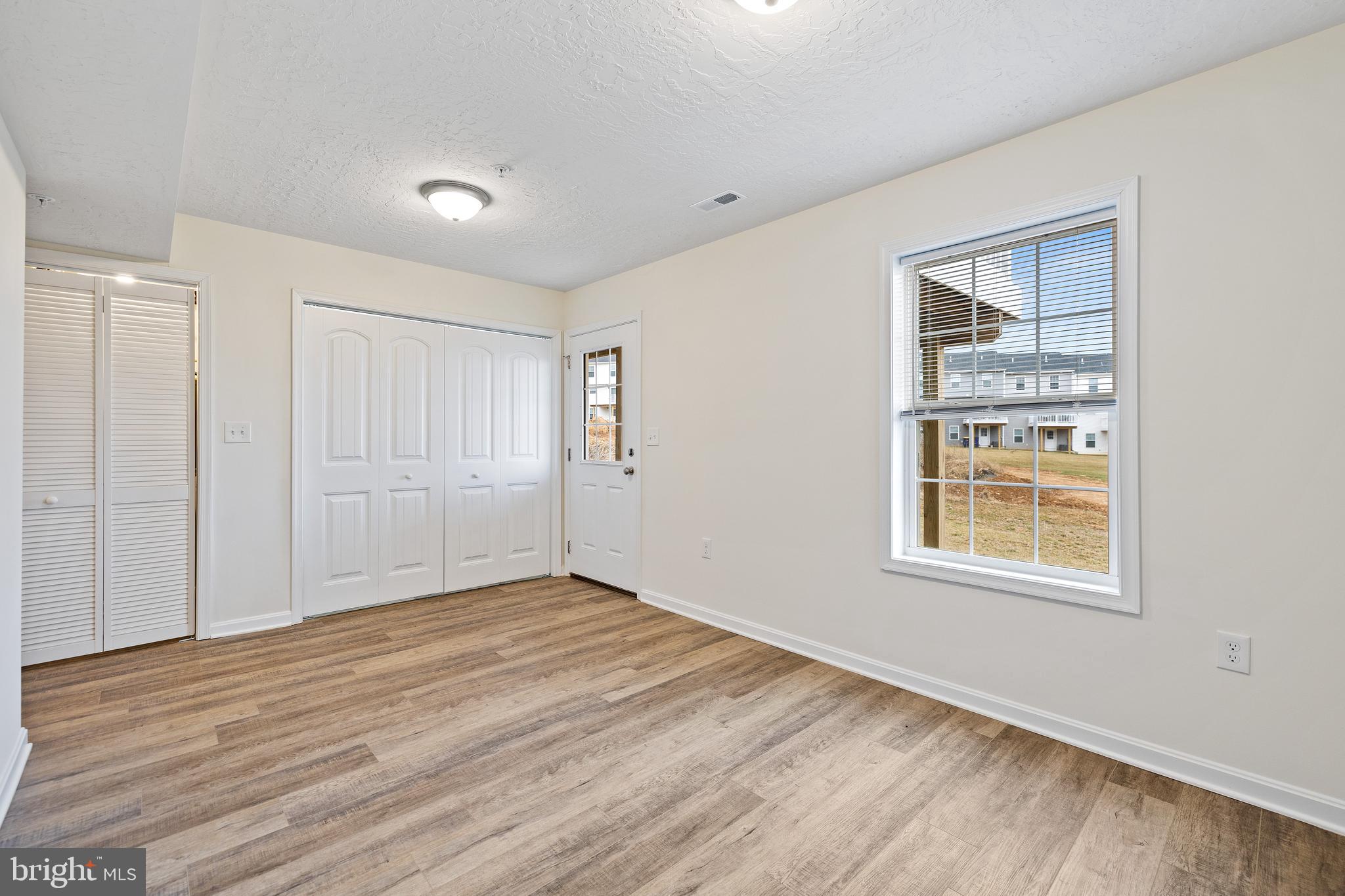 495 South Spring Garden Street, Unit 600 Carlisle, PA 17013 - Photo 25 of 26 a view of an empty room with wooden floor and a window