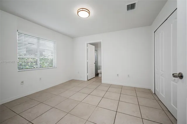 a bathroom with a sink a toilet a mirror and vanity