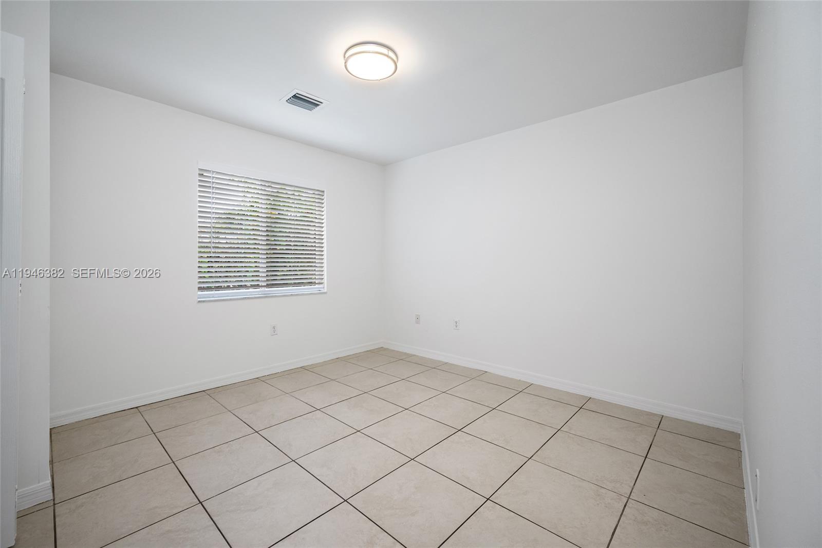 2275 Southwest 61st Avenue Miami, FL 33155 - Photo 18 of 53 an empty room with windows