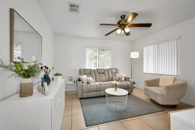 a kitchen with cabinets appliances a sink and a window