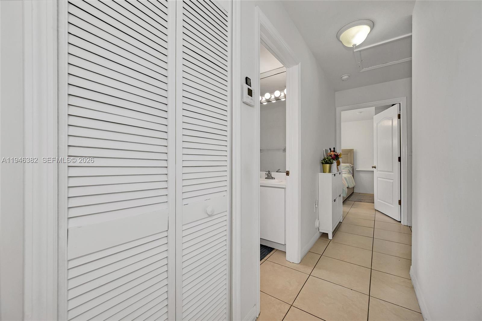 2275 Southwest 61st Avenue Miami, FL 33155 - Photo 35 of 53 a view of a hallway with closet and a bathroom
