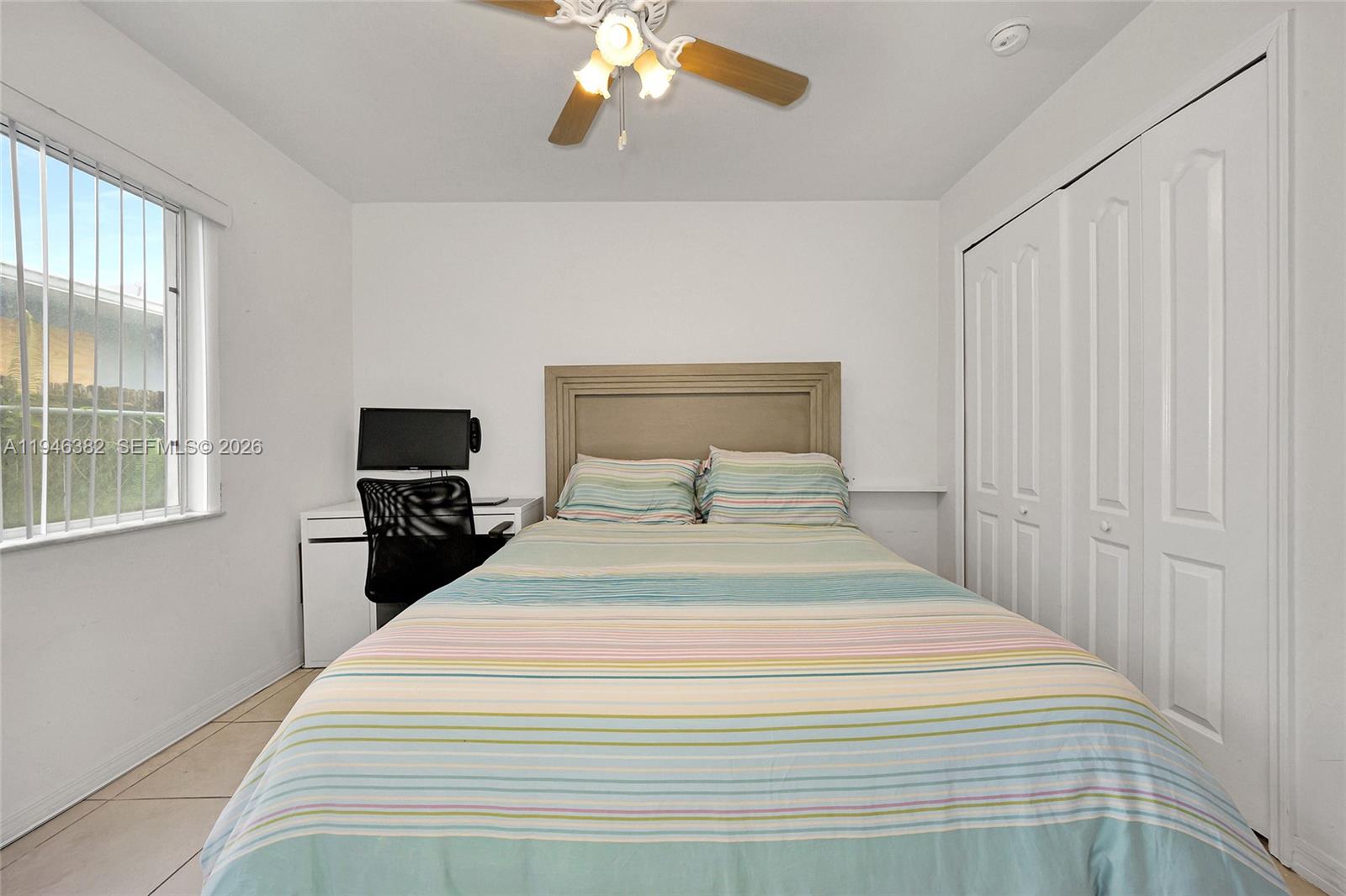 2275 Southwest 61st Avenue Miami, FL 33155 - Photo 37 of 53 a bedroom with a bed and a tv