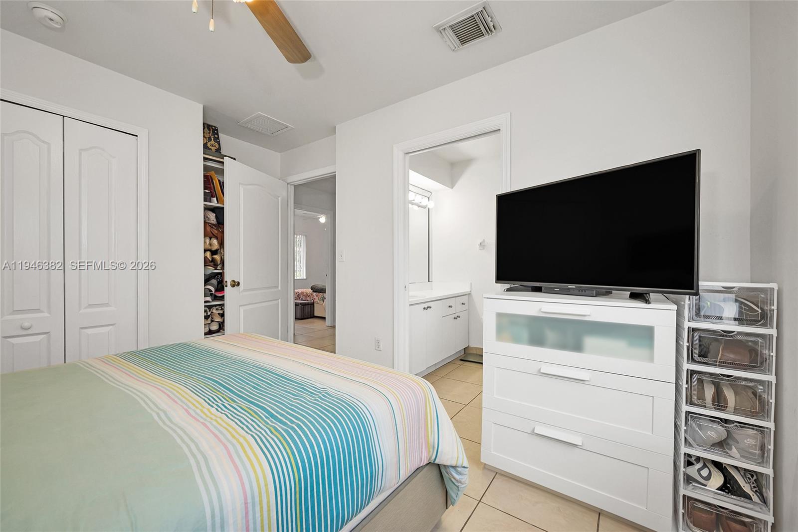 2275 Southwest 61st Avenue Miami, FL 33155 - Photo 38 of 53 a bedroom with a bed and a flat screen tv