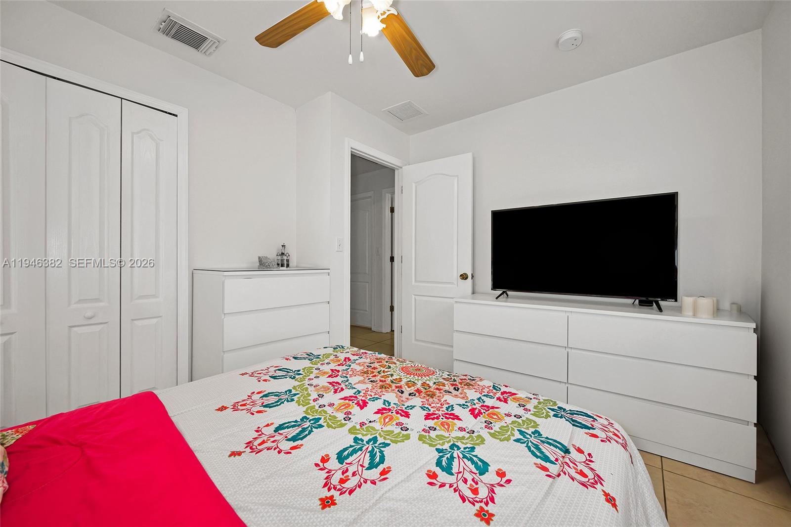 2275 Southwest 61st Avenue Miami, FL 33155 - Photo 42 of 53 a bedroom with a bed and a flat screen tv in it