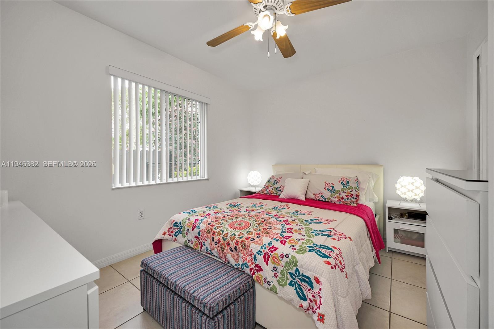 2275 Southwest 61st Avenue Miami, FL 33155 - Photo 43 of 53 a bedroom with a bed and a chandelier