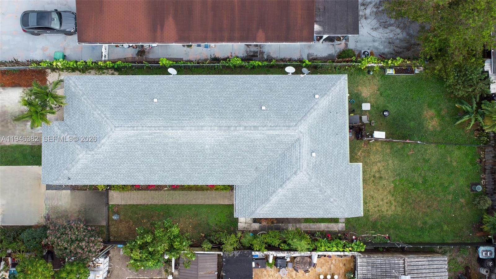 2275 Southwest 61st Avenue Miami, FL 33155 - Photo 48 of 53 an aerial view of a house with a yard and a car parked